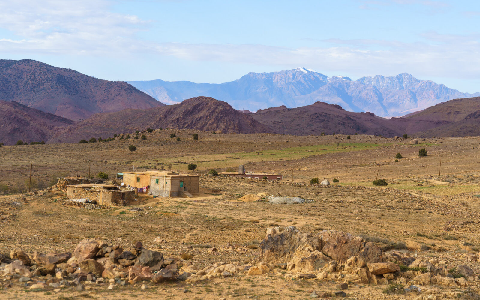 Remote mountain village under a vast sky