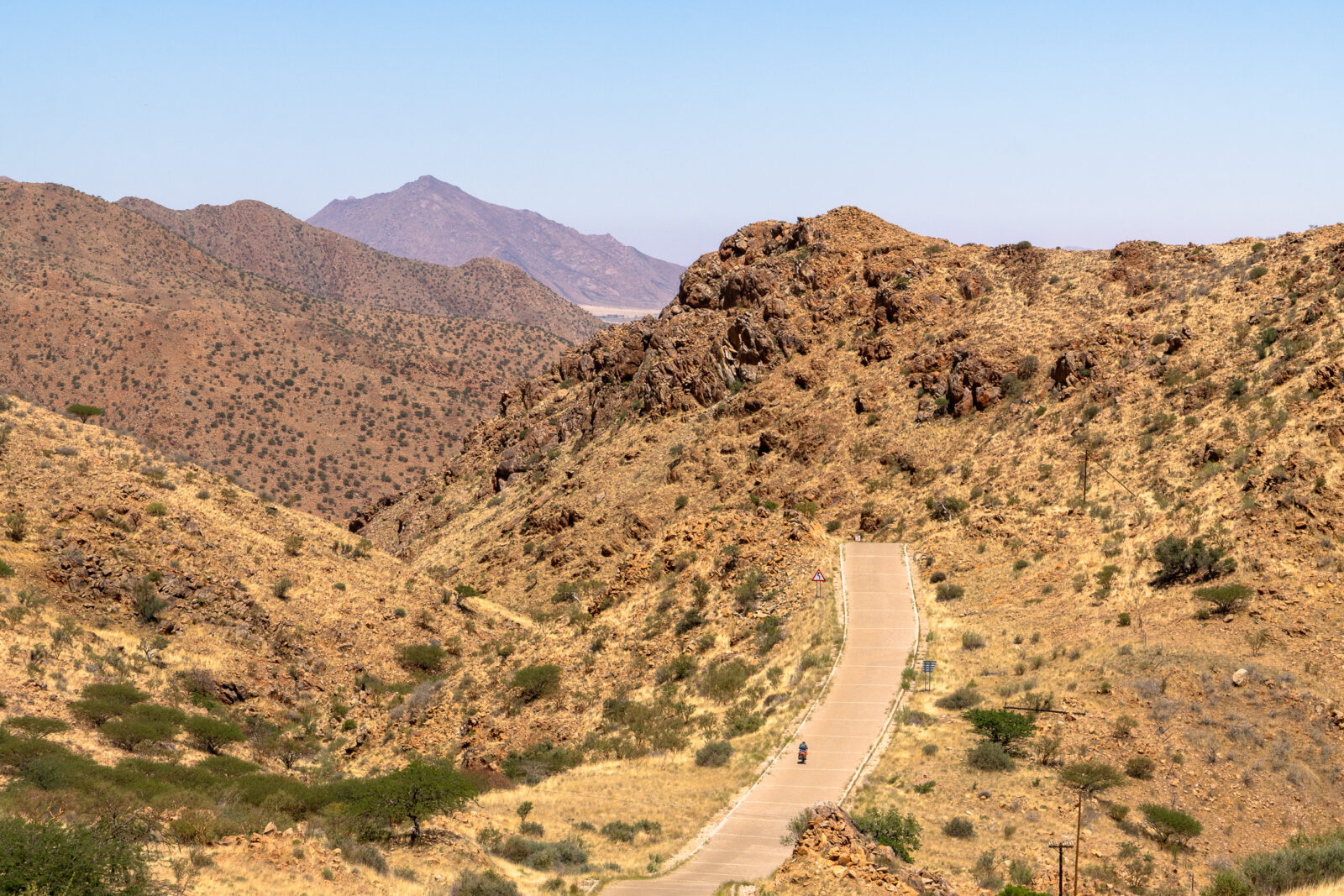 Solitary journey on a winding mountain road