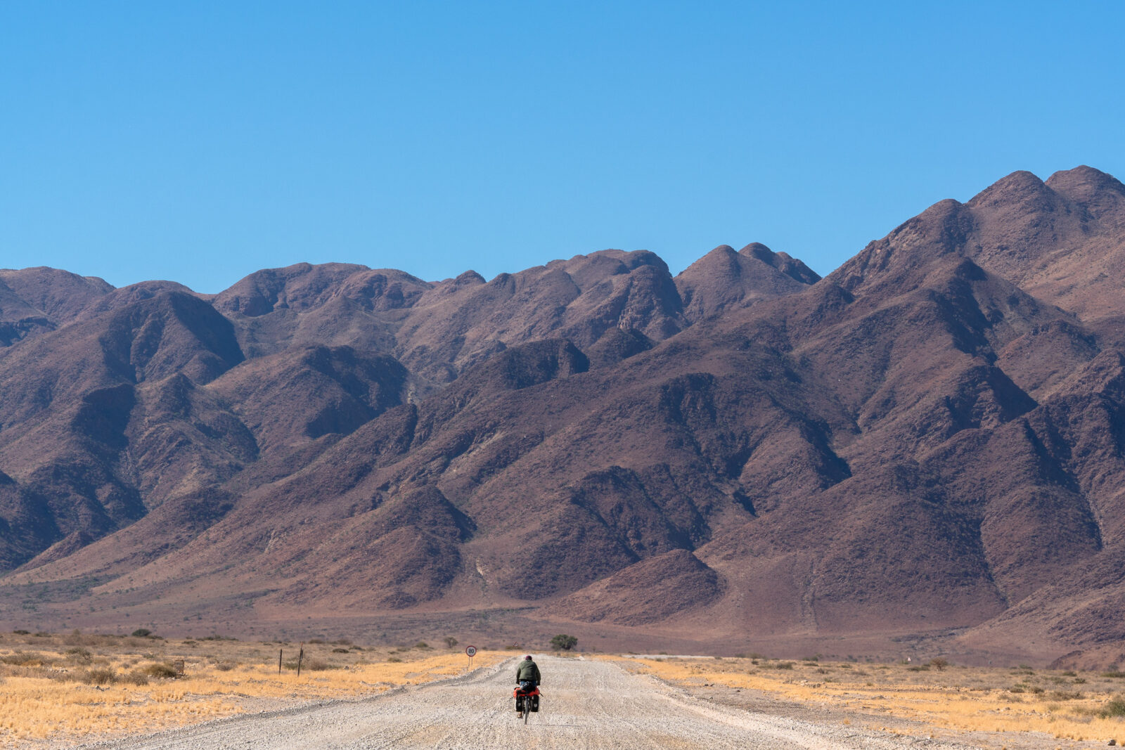 Solitary ride through rugged landscapes
