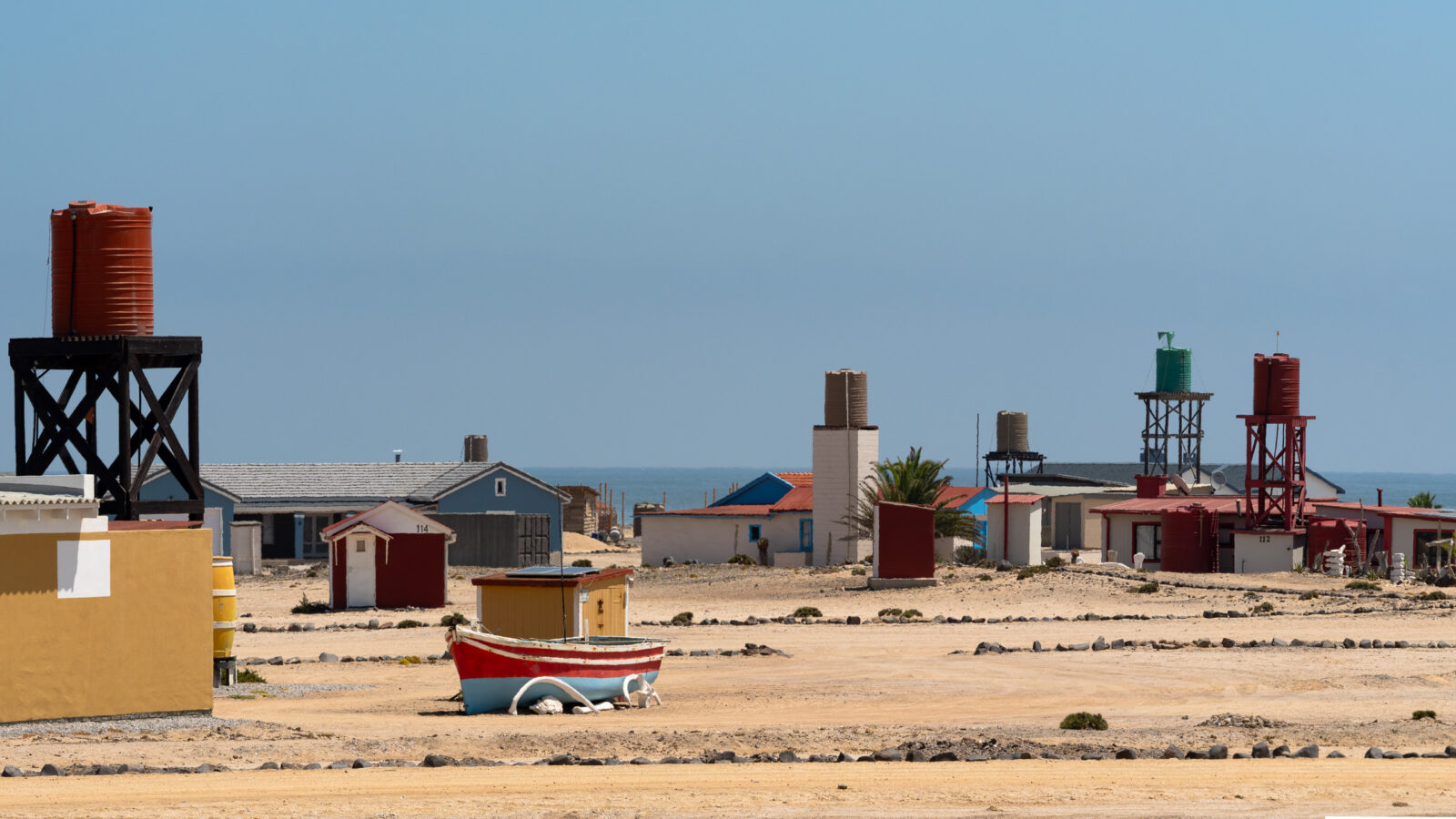 Colorful desert homes meet the distant sea