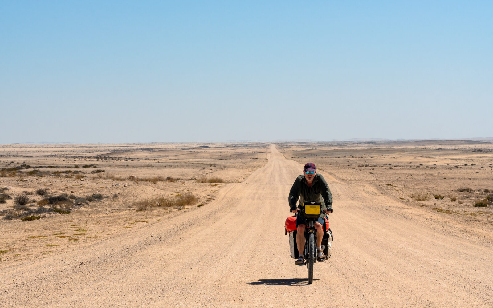 Solitary ride on the endless desert road