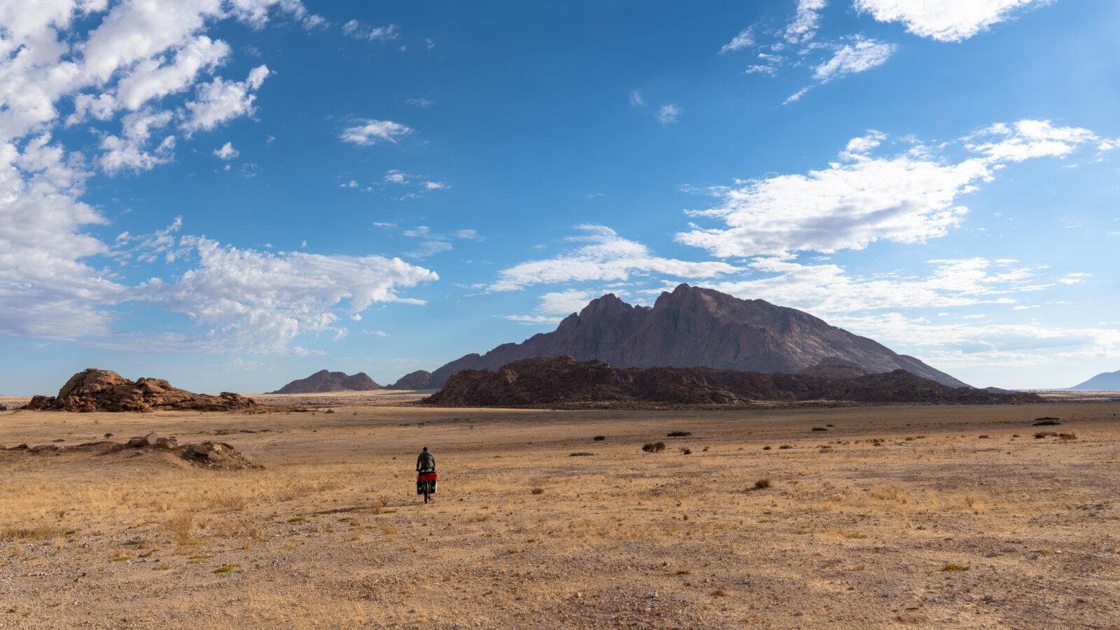 Solitary ride through the desert mountains