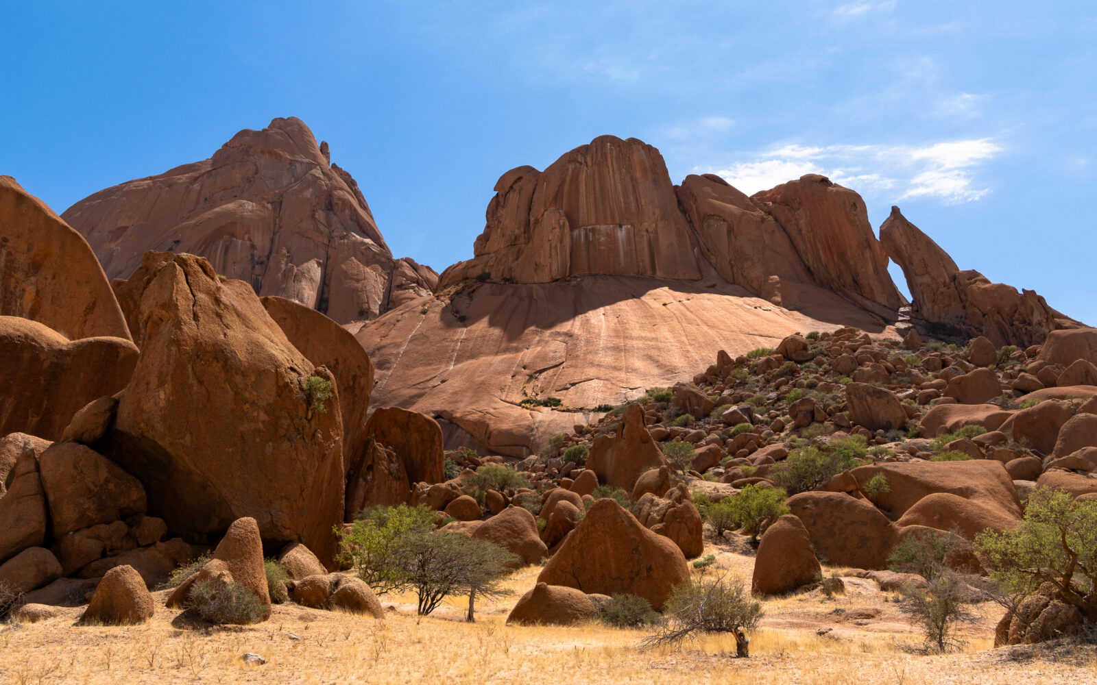 Sculpted desert rocks beneath a boundless blue