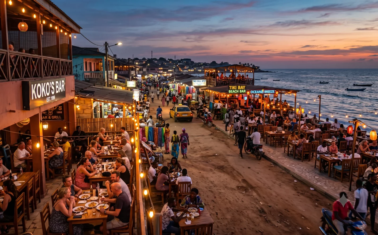 Toeristenstrip met bars en terrassen langs de West-Afrikaanse kust bij avond